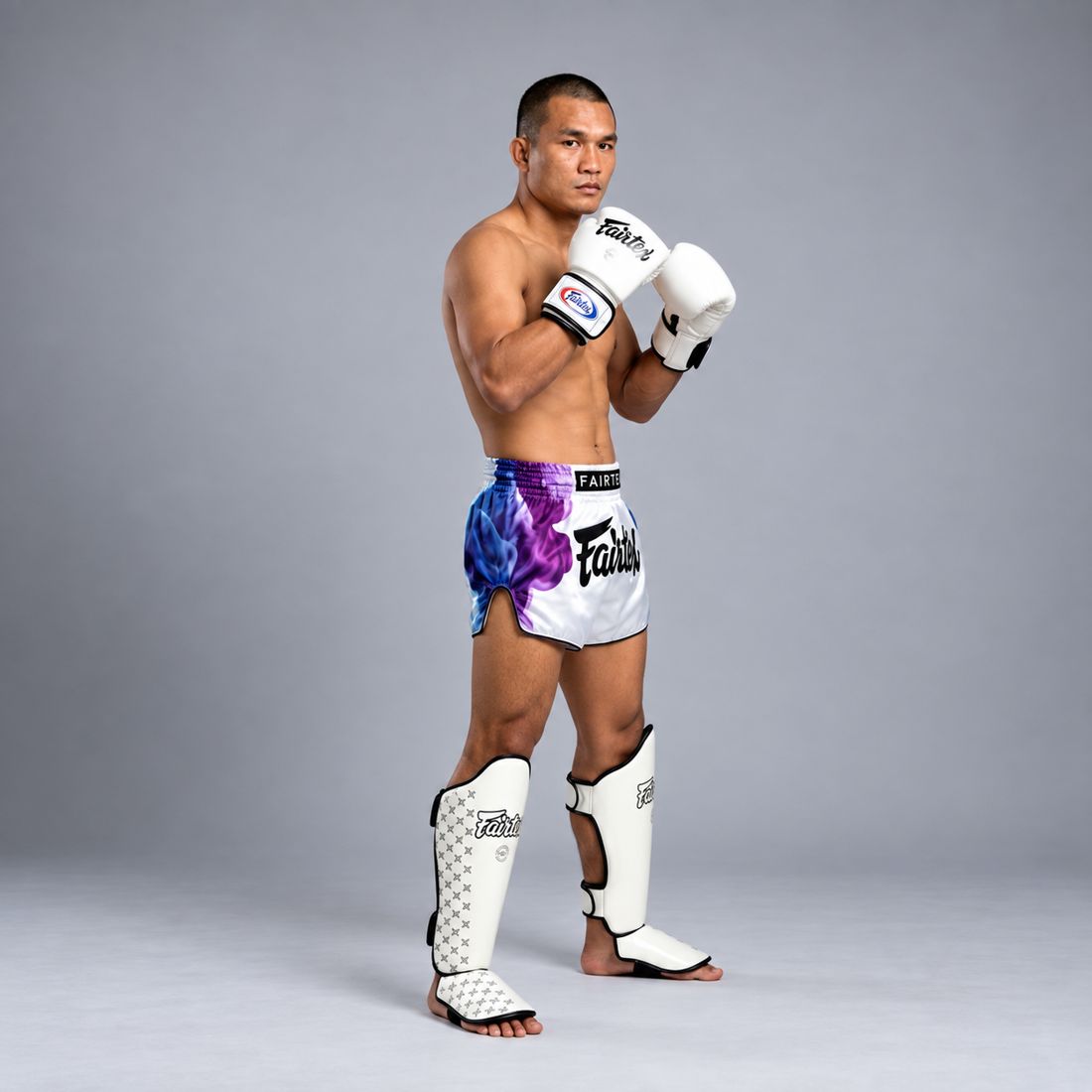 The same fighter in guard stance, side view showing the full shin and instep cover